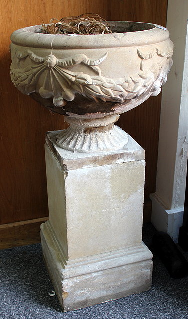 Appraisal: A COMPOSITE STONE URN on a square plinth base overall