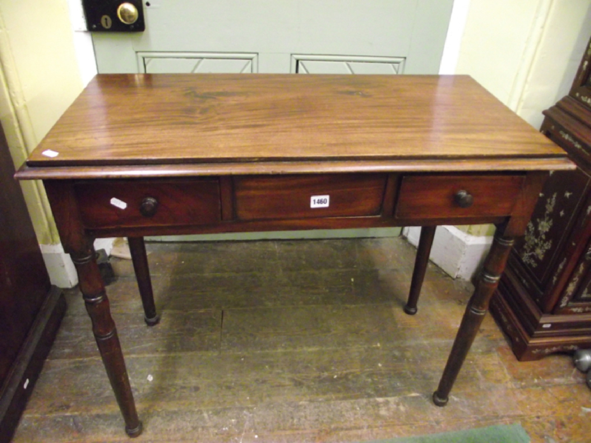 Appraisal: A mahogany side table fitted with two frieze drawers on