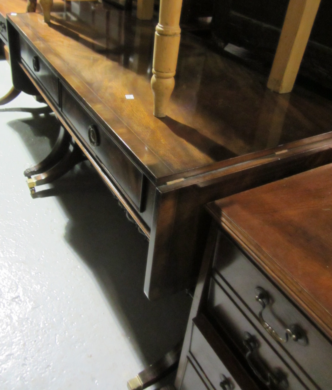 Appraisal: A th century mahogany sofa table and a late th