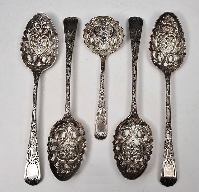 Appraisal: A FIVE PIECE SILVER BERRY SPOON SET consisting of four