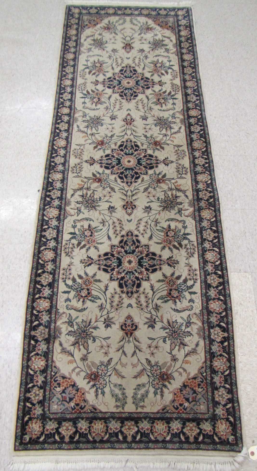 Appraisal: HAND KNOTTED ORIENTAL RUNNER Indo-Persian triple medallion and overall floral