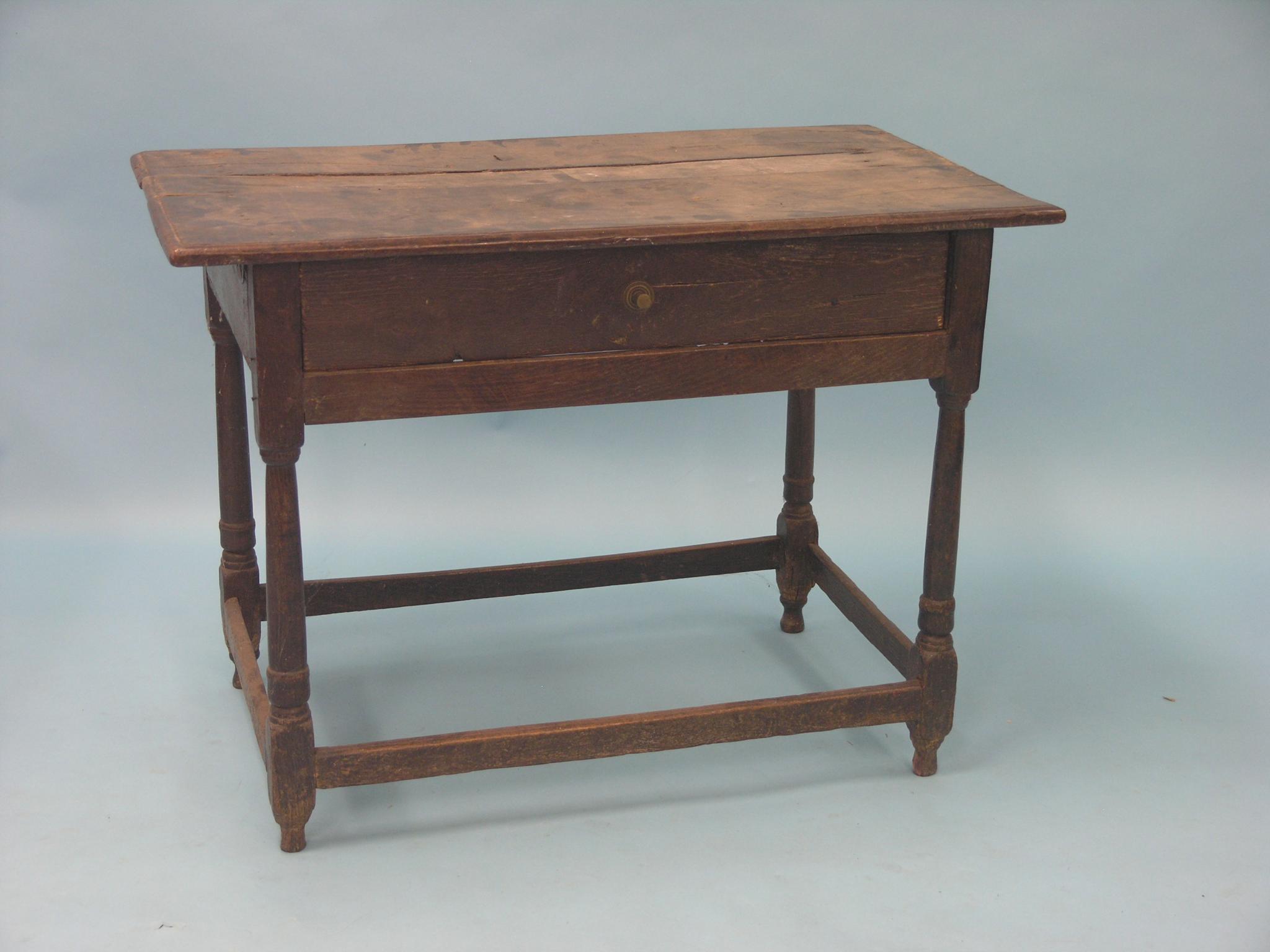 Appraisal: A George III oak side table rectangular shape with single