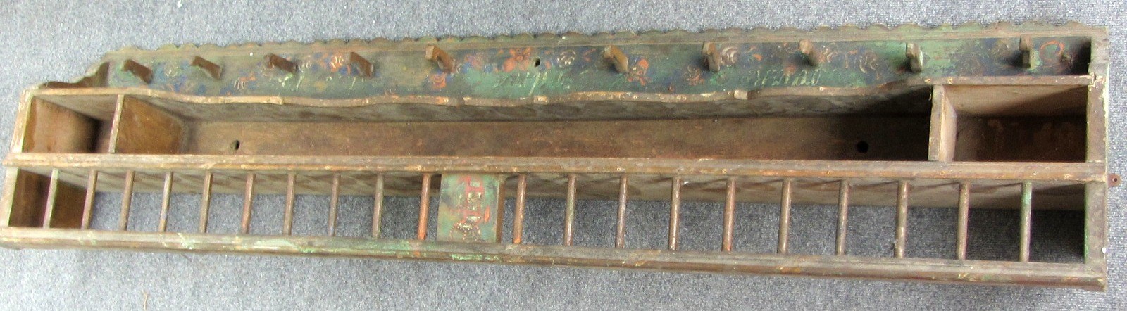 Appraisal: A th century painted European pine plate rack with peg