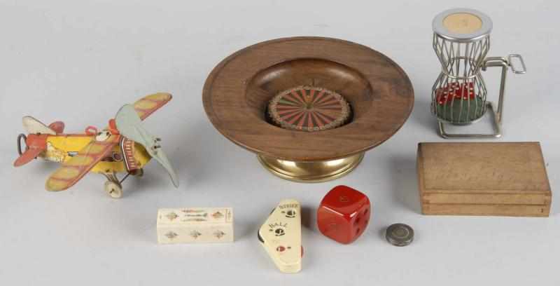 Appraisal: Lot of Gambling Devices Description Includes one mini roulette wheel