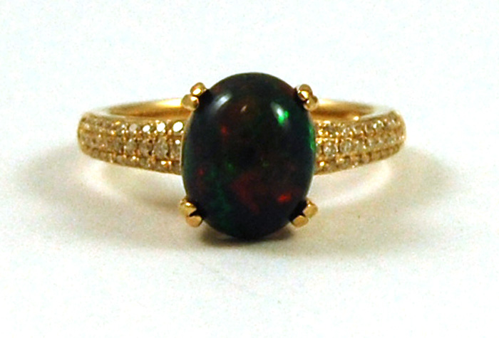 Appraisal: BLACK OPAL DIAMOND AND FOURTEEN KARAT GOLD RING with round-cut