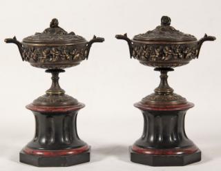 Appraisal: PAIR OF FRENCH CLASSICAL RAISED FLORAL DESIGN BRONZE CAPPED URNS