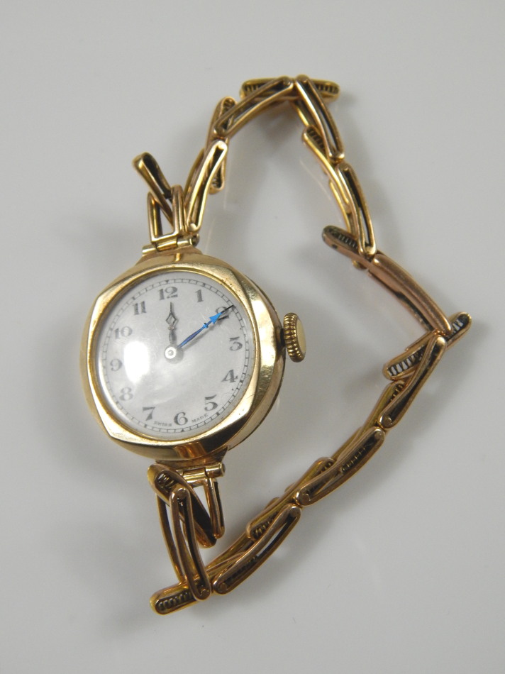 Appraisal: A ladies wristwatch with circular white enamel dial and blue