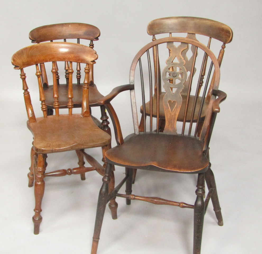 Appraisal: A pair of Victorian oak and elm kitchen chairs oak