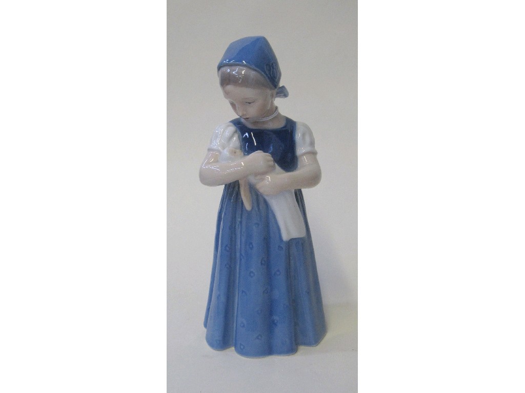 Appraisal: Royal Copenhagen figure of a girl holding a doll