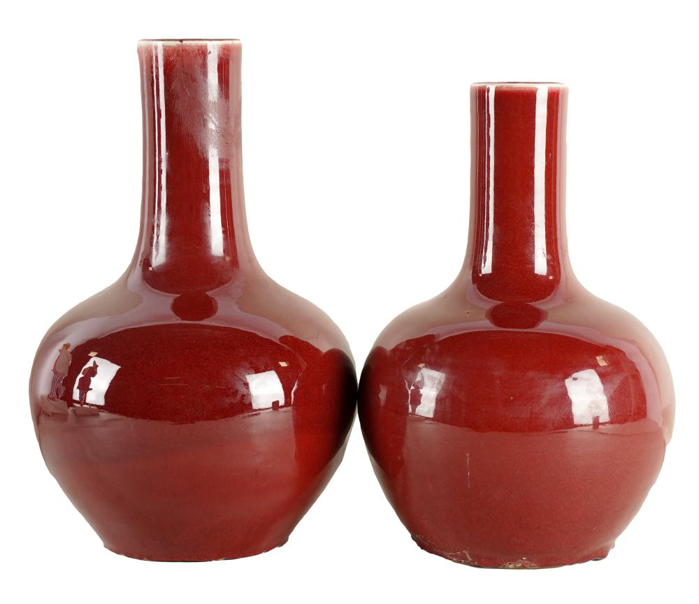 Appraisal: PAIR OF CHINESE-STYLE OXBLOOD PORCELAIN VASESeach with four-character mark to