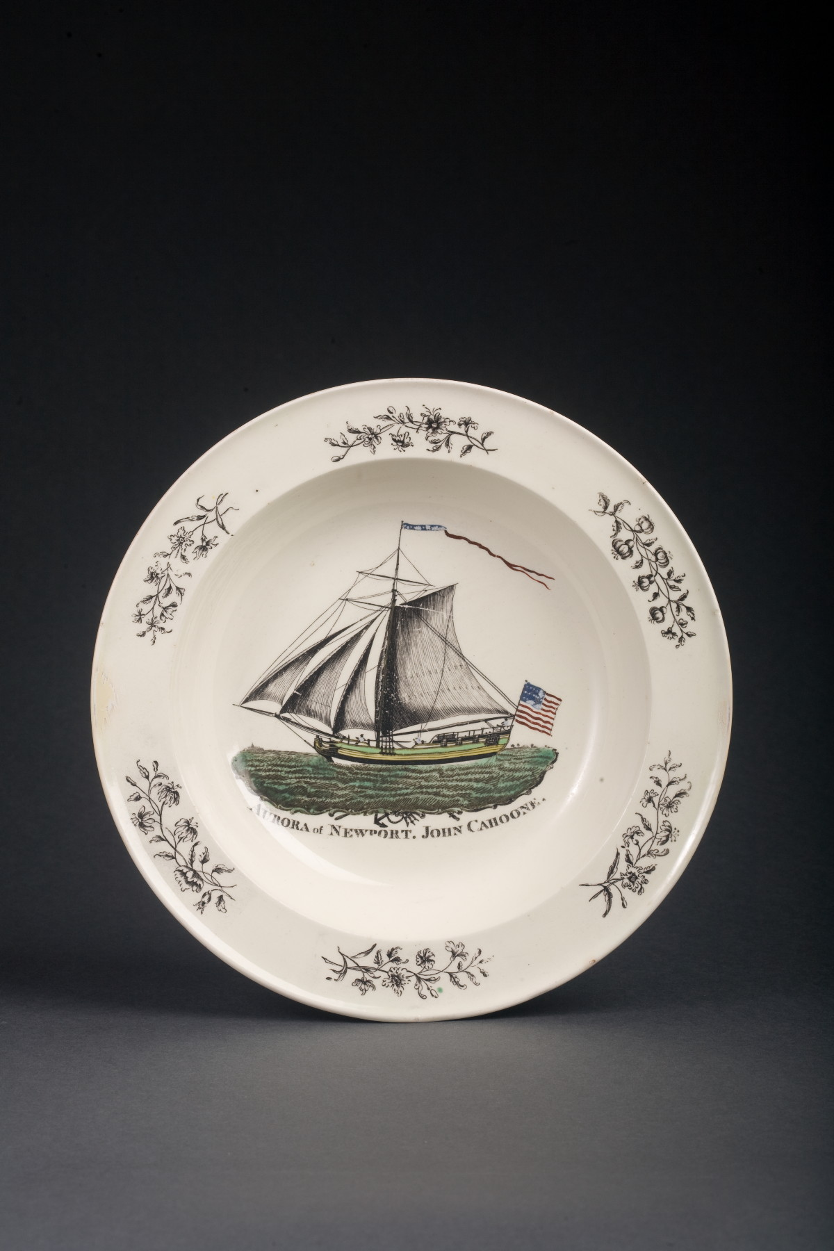 Appraisal: ENGLISH CREAMWARE ENAMEL-DECORATED AND BLACK TRANSFER-PRINTED SOUP PLATE STAFFORDSHIRE CIRCA