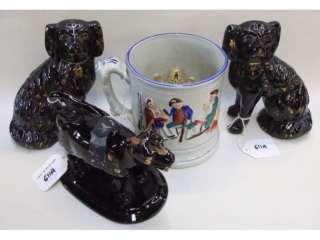 Appraisal: Staffordshire frog tankard pair of black wally dugs and a