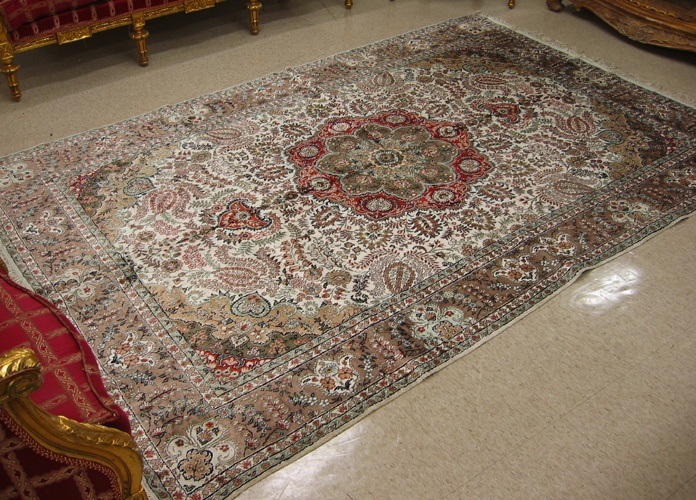 Appraisal: HAND KNOTTED ORIENTAL CARPET Sino-Persian faux silk floral and central