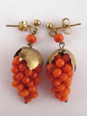 Appraisal: A pair of gilt metal tests silver coral earrings designed