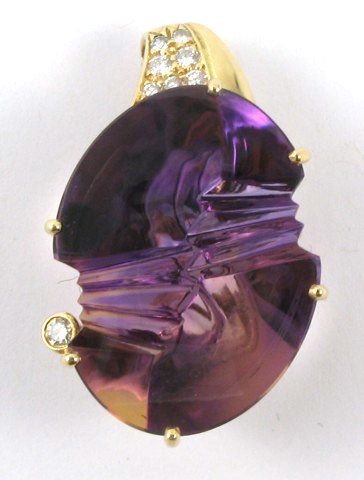 Appraisal: AMETHYST DIAMOND AND YELLOW GOLD PENDANT k gold set with