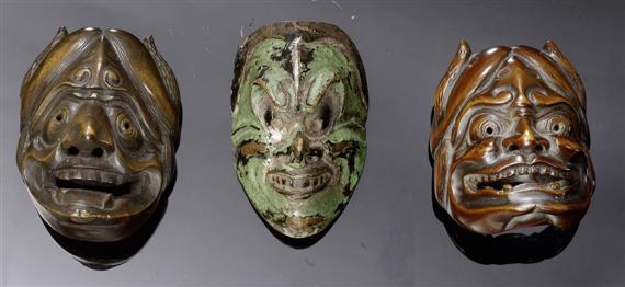 Appraisal: THREE DEMON-MASK NETSUKE CARVED WOOD ONE SIGNED AND ONE IN