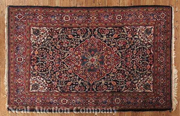 Appraisal: A Small Antique Persian Rug red ground central medallion overall