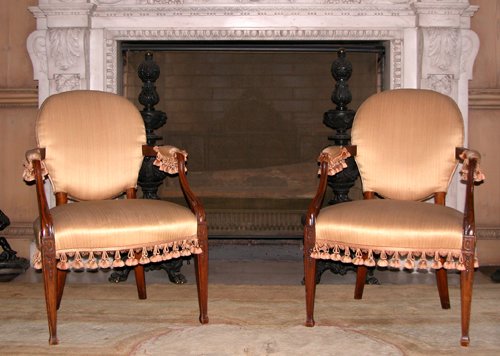 Appraisal: Title Pair of Georgian-Style Carved Mahogany open armchairs with gold