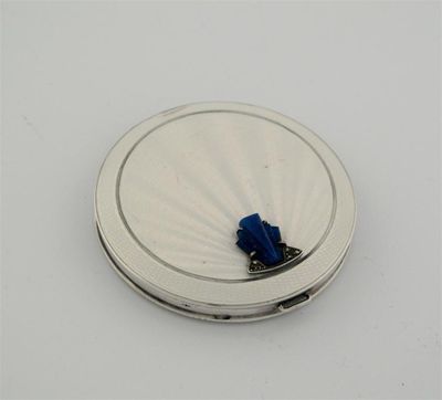 Appraisal: An Art Deco circular compact pearlescent enamel on a wavy