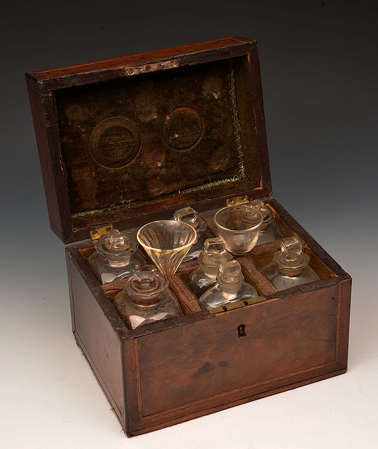 Appraisal: A GEORGE III MAHOGANY APOTHECARY BOX fitted seven bottles and