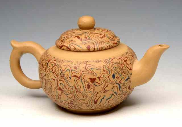 Appraisal: A CHINESE YIXING STONEWARE TEAPOT and cover contemporary marbled in