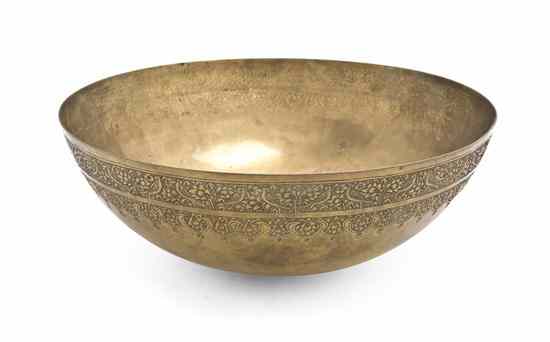 Appraisal: A Middle Eastern Brass Bowl of hemispherical form with flattened