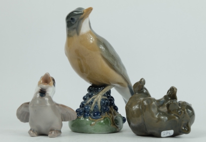 Appraisal: Royal Copenhagen bird with berry's seated chick and bear cub