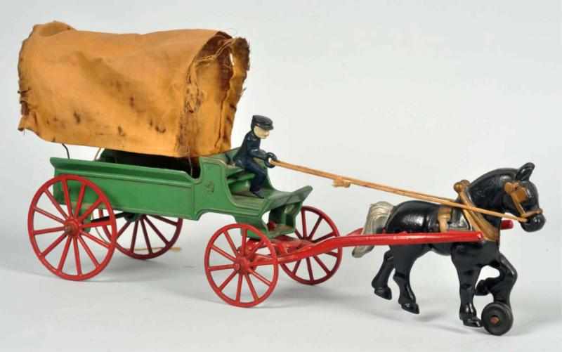 Appraisal: Cast Iron Kenton Horse-Drawn Covered Wagon Toy Circa s Original