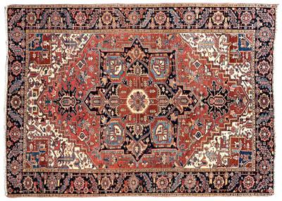 Appraisal: Heriz rug varying blue central medallion on pale salmon field