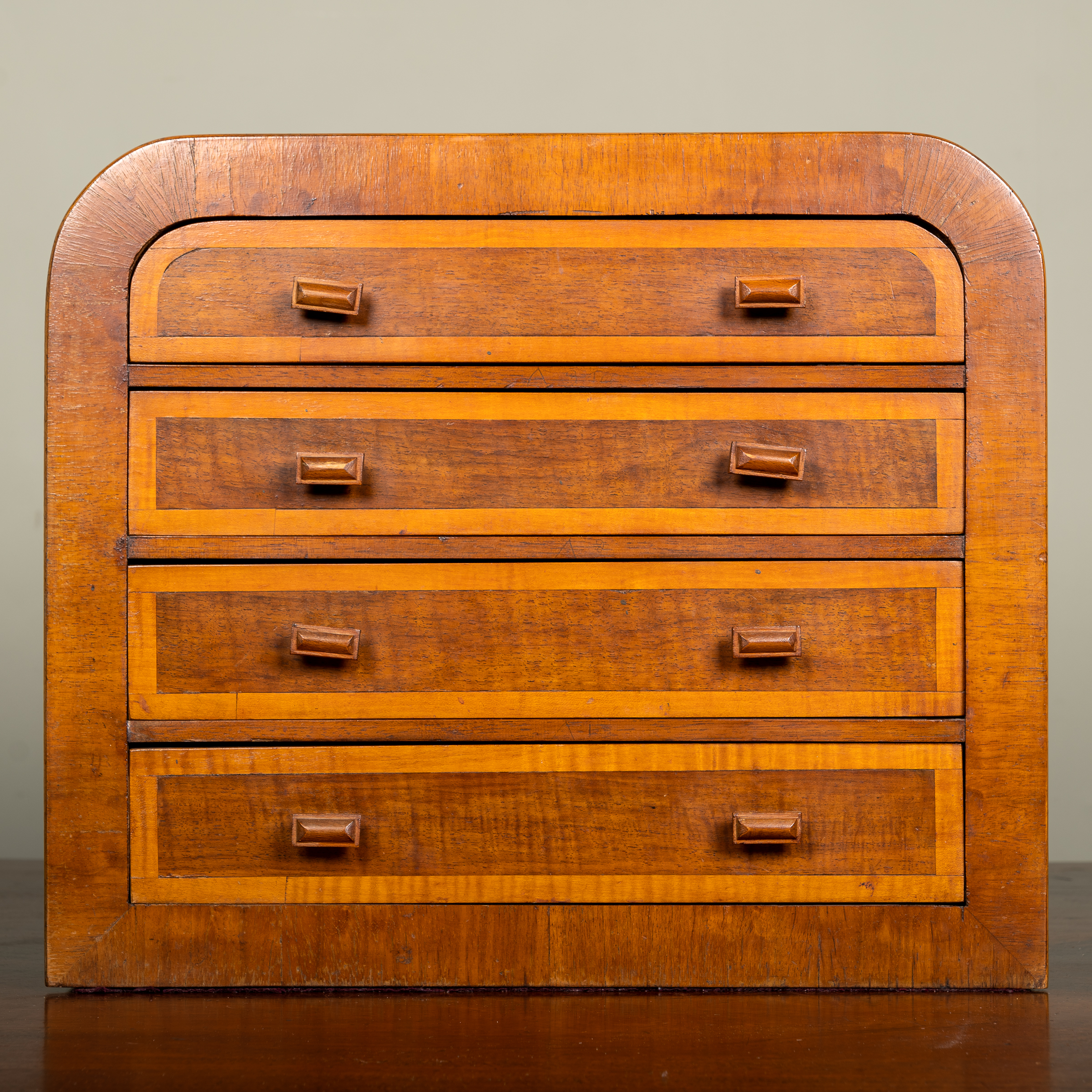 Appraisal: An early th century mahogany tabletop chest of four drawers