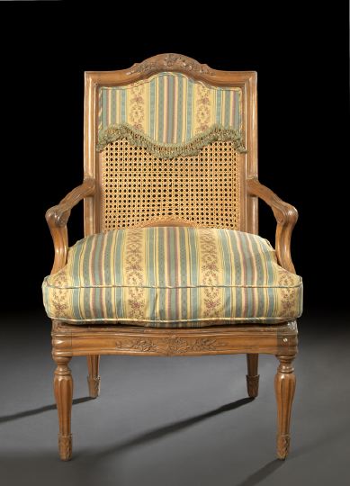 Appraisal: Provincial Fruitwood Fauteuil early th century the domed and molded