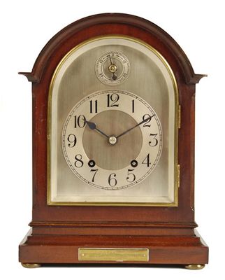 Appraisal: A mahogany mantel clock with an day movement striking on