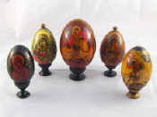 Appraisal: Five Russian wooden Easter eggs decorated with religious themes largest