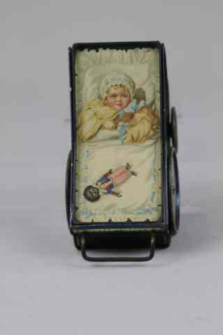 Appraisal: BABY CARRIAGE BISCUIT TIN c Lithographed tinplate strikingly finished in