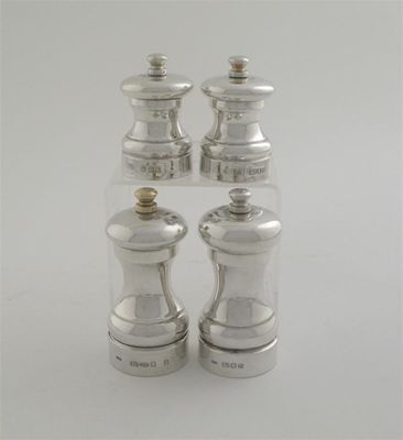 Appraisal: Two small and two larger modern pepper mills