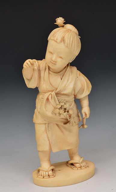 Appraisal: A Japanese ivory okimono of an infantMeiji periodsigned Nakime standing