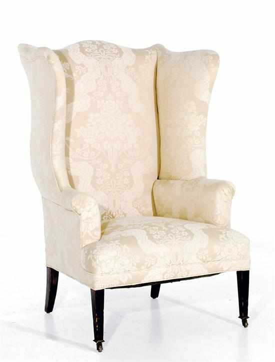 Appraisal: Hepplewhite style mahogany wingback armchair late th century serpentine-crested back