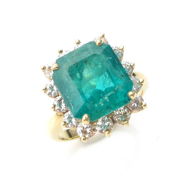 Appraisal: An emerald diamond and k gold ring rectangular-cut emerald surround