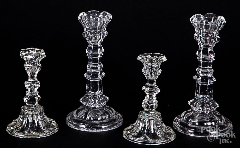 Appraisal: Two pairs of colorless glass candlesticks Two pairs of colorless