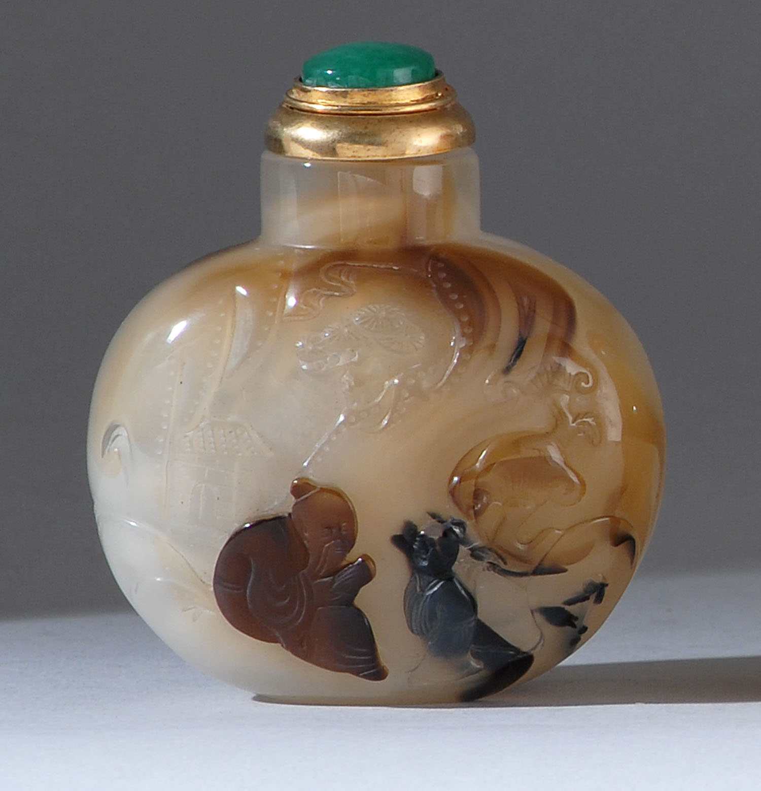 Appraisal: CHALCEDONY AGATE SNUFF BOTTLE th CenturyIn Suzhou style Depicting a