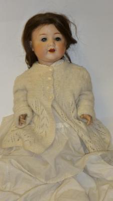 Appraisal: An Armand Marseille bisque head girl doll with blue glass