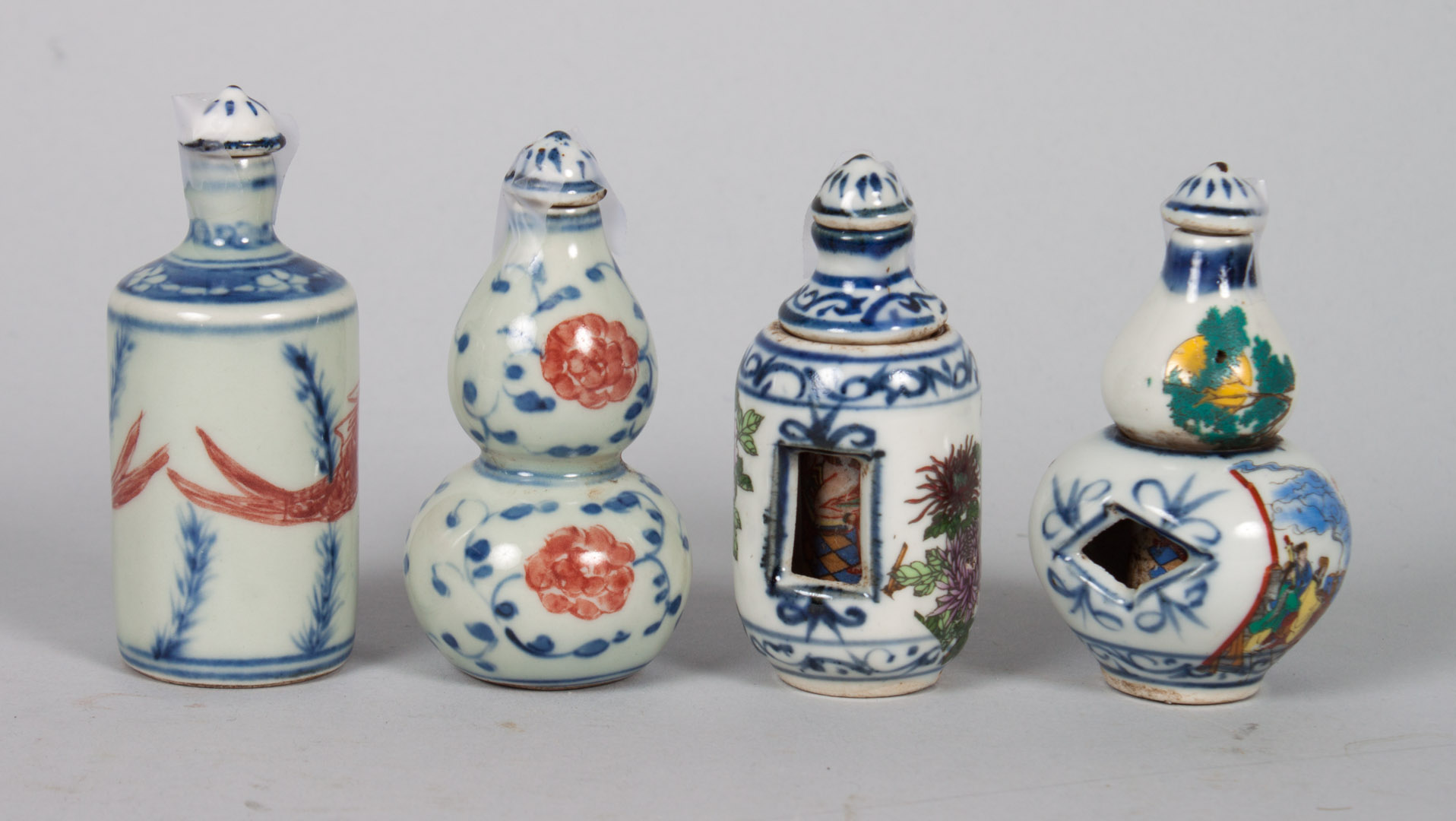 Appraisal: Four Chinese porcelain snuff bottles one with Famille Rose floral