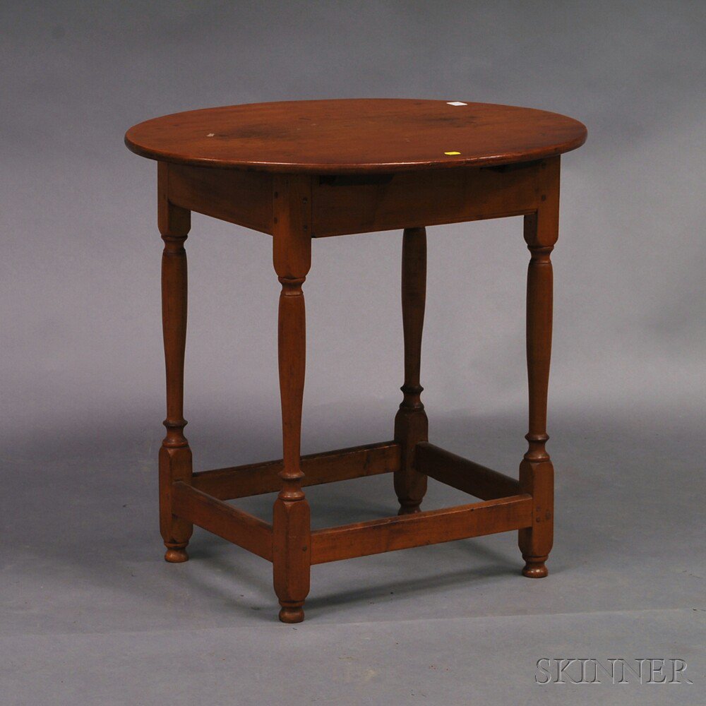 Appraisal: Country Pine and Cherry Oval-top Tea Table with block- and