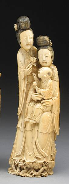 Appraisal: A fine ivory figural group Well carved and incised as