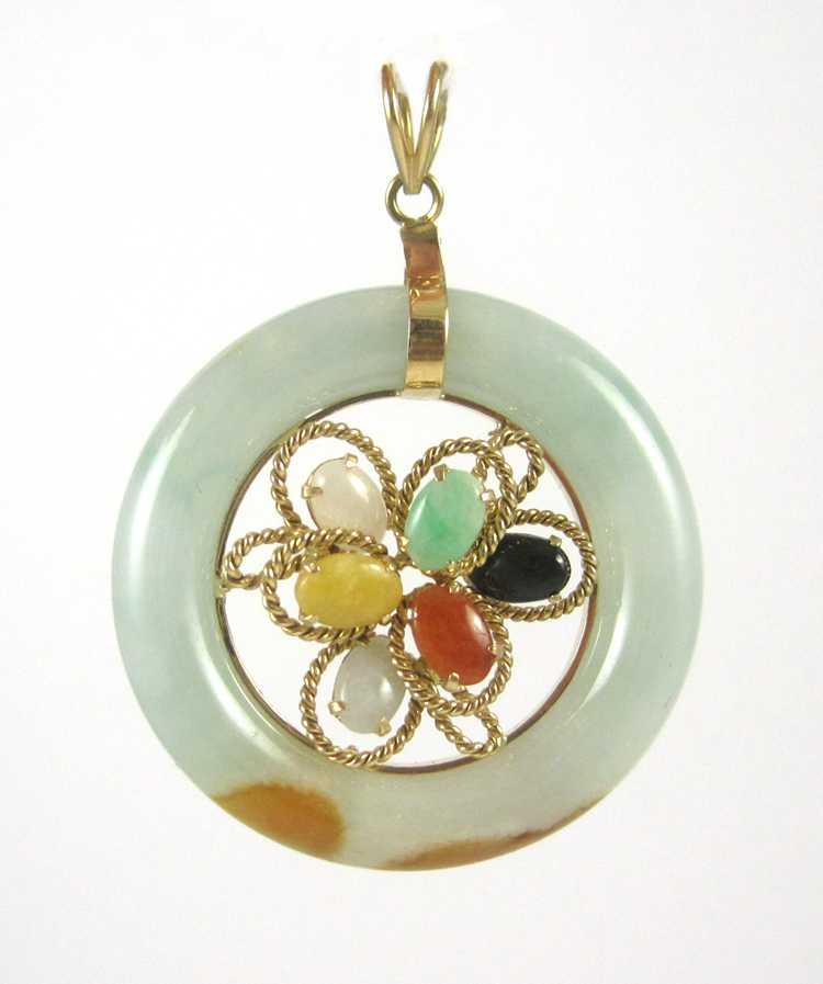 Appraisal: JADE AND FOURTEEN KARAT GOLD PENDANT with a round jade