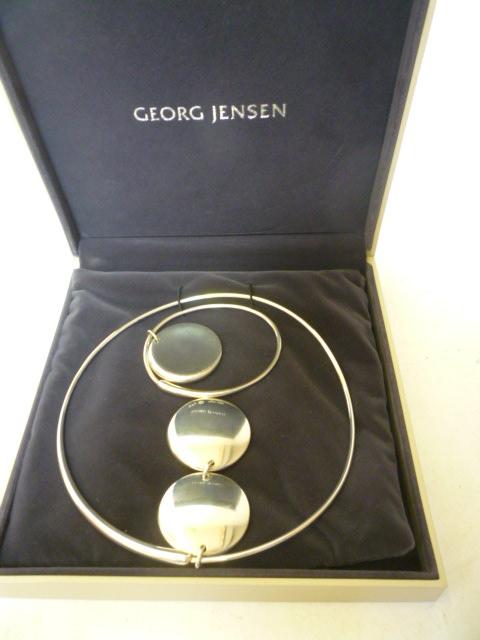 Appraisal: A GEORG JENSEN ZERO SILVER NECKLET AND MATCHING BANGLE designed