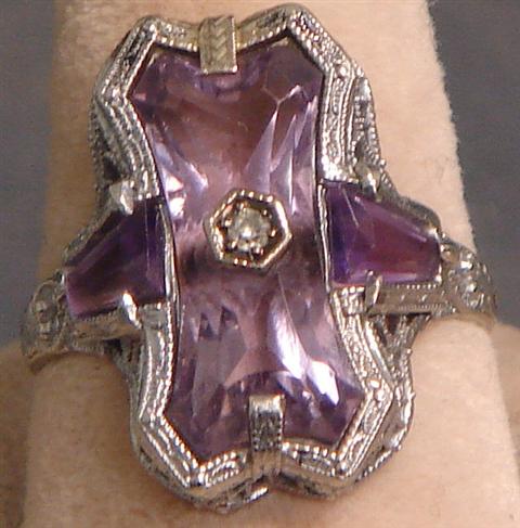 Appraisal: K WG filigree amethyst ring very unusual waisted cut stone