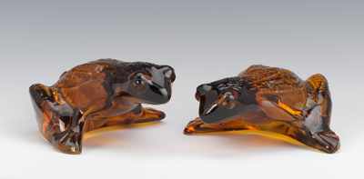 Appraisal: A Pair of Lalique Colored Glass Frogs Two amber frogs