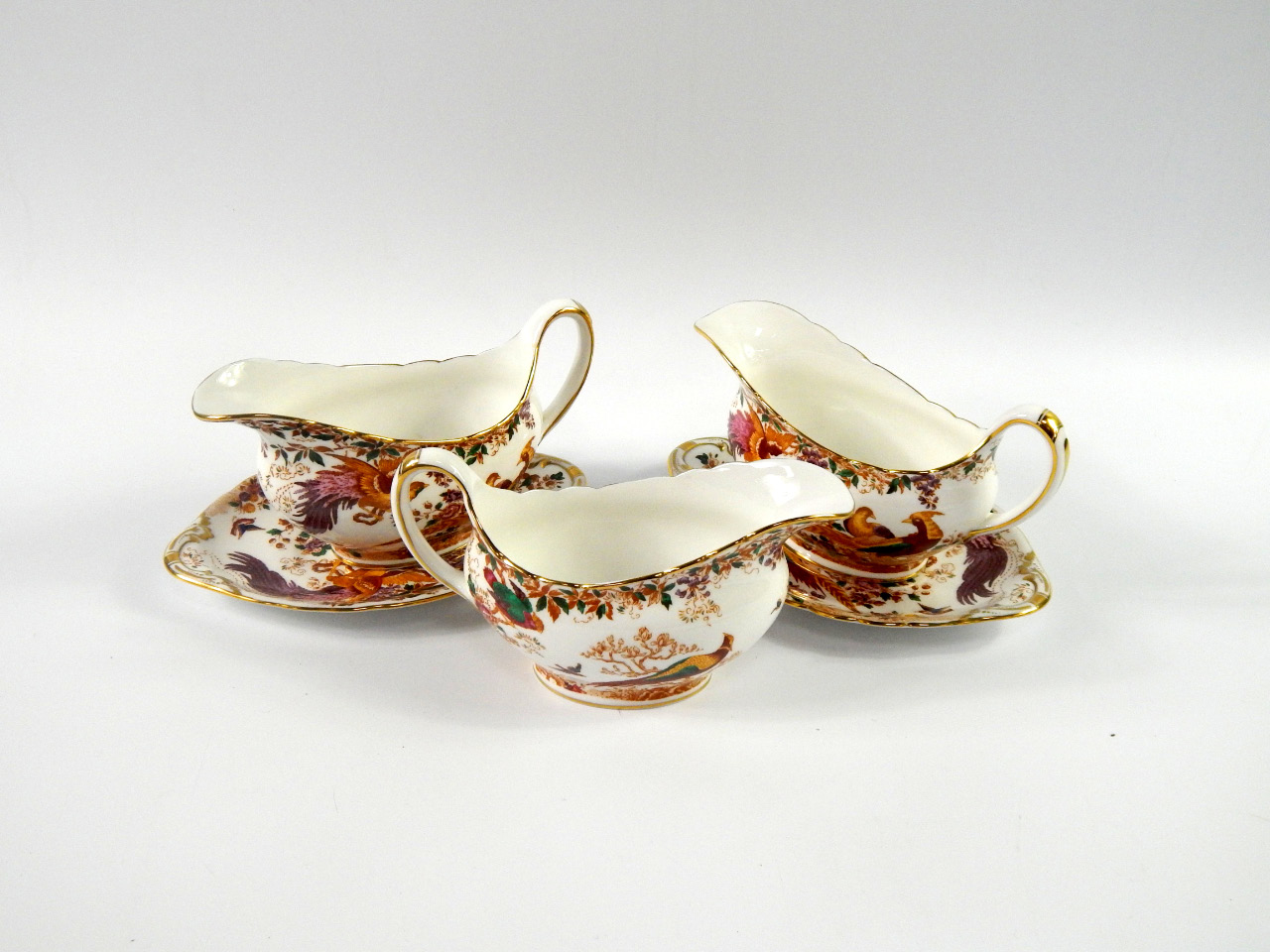 Appraisal: Three Royal Crown Derby porcelain sauce boats and two stands