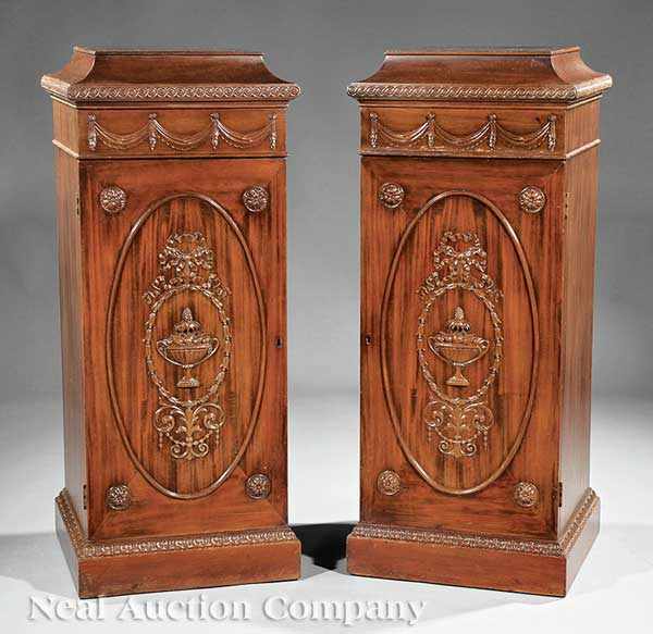 Appraisal: A Pair of Georgian-Style Carved Mahogany Pedestal Cabinets th c